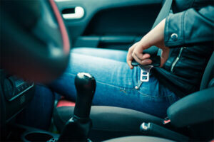 Passenger unbuckling seat belt after an accident